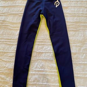 Peloton medium Navy blue with green stripe. WUC. Worn once and hung to dry!